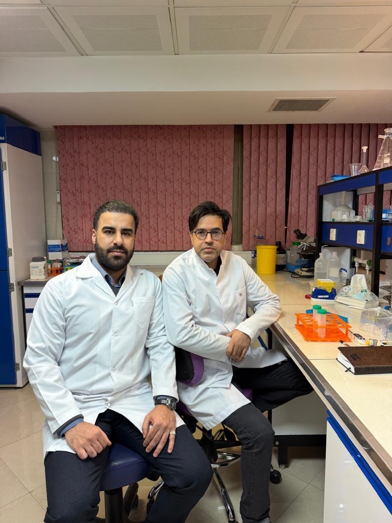 Scientific team members reviewing laboratory work together